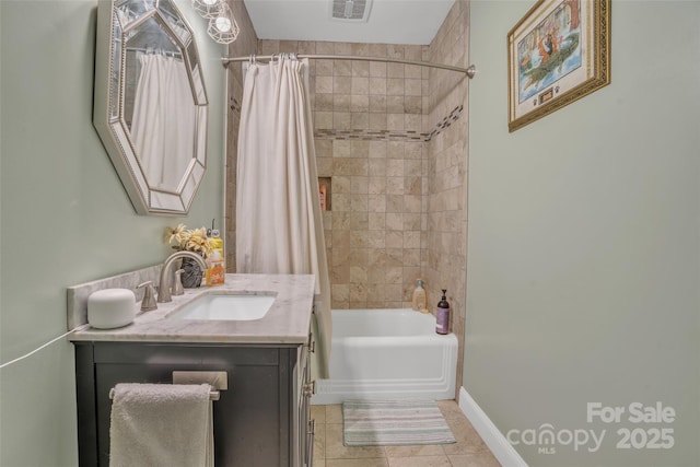 bathroom featuring tile patterned flooring, vanity, and shower / tub combo with curtain