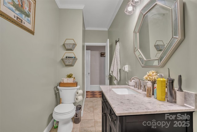 bathroom with vanity, crown molding, and toilet