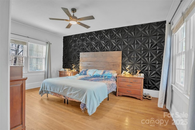 bedroom featuring wood-type flooring and ceiling fan