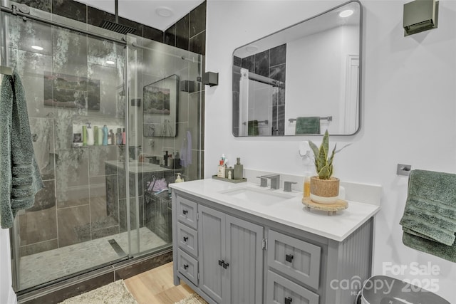 bathroom with vanity and an enclosed shower