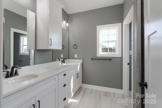 bathroom with vanity and a wealth of natural light