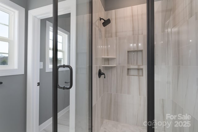 bathroom with a shower with shower door