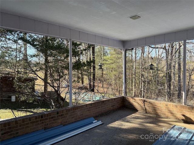 unfurnished sunroom featuring visible vents