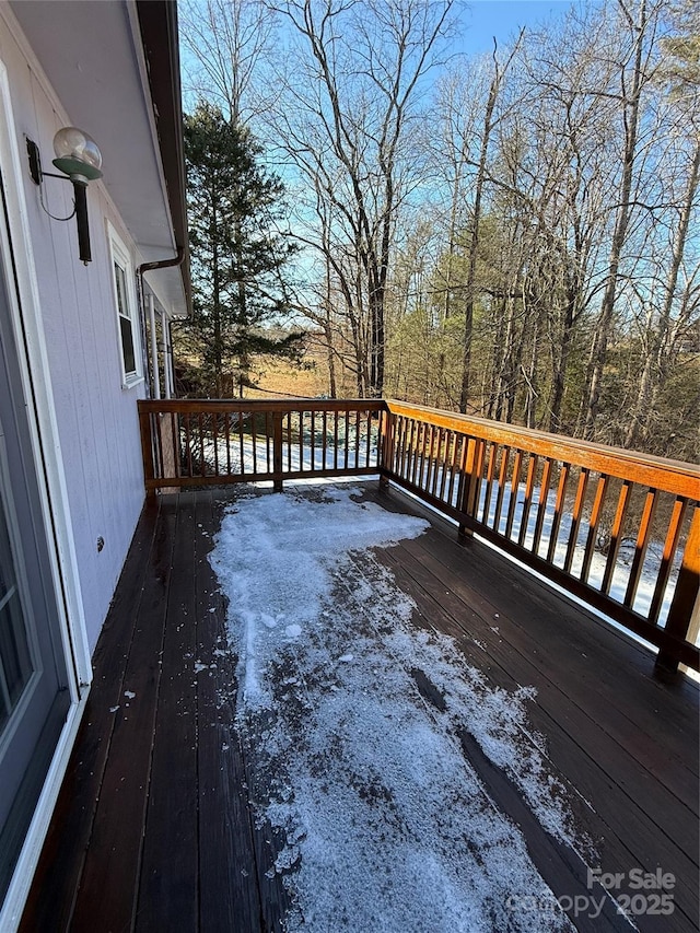 wooden deck featuring a water view