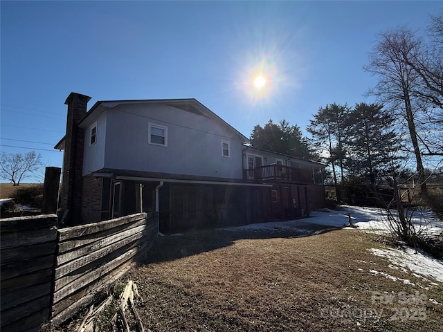 view of side of home with a chimney