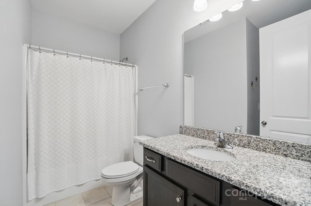 full bathroom with shower / bath combo, tile patterned floors, vanity, and toilet