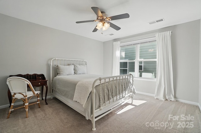 carpeted bedroom with ceiling fan, baseboards, and visible vents