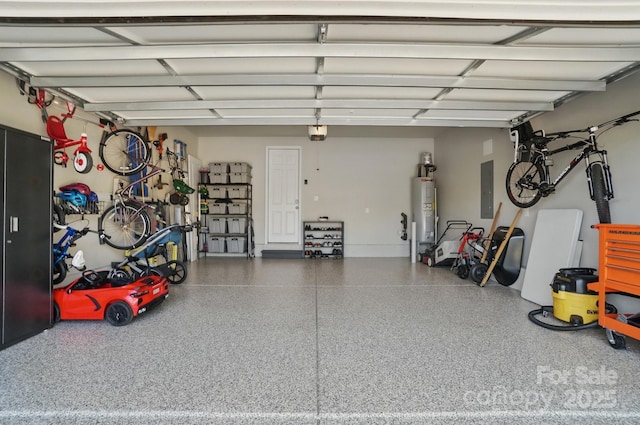 garage with electric water heater and electric panel