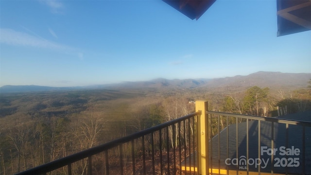 balcony featuring a mountain view