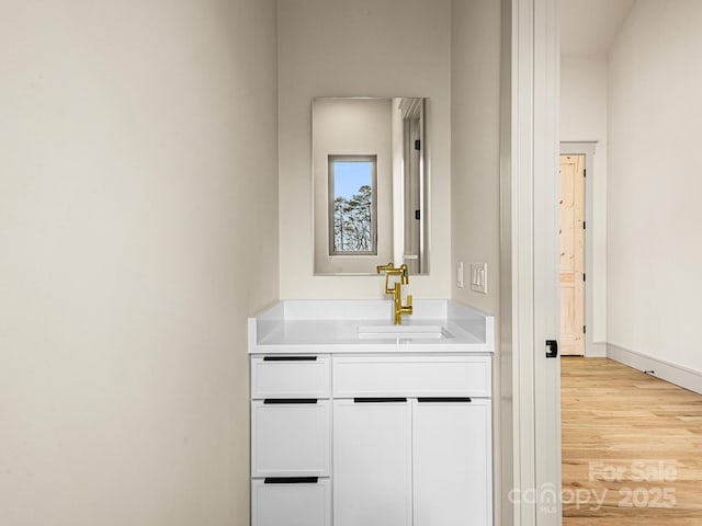 246 Half Moon Mile, Lake Lure, NC 28746 - bathroom featuring wood finished floors, vanity, and baseboards