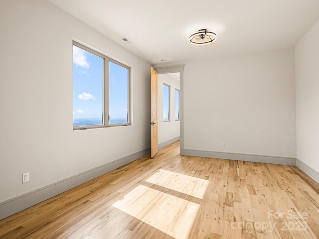 246 Half Moon Mile, Lake Lure, NC 28746 - empty room with light wood-type flooring and baseboards