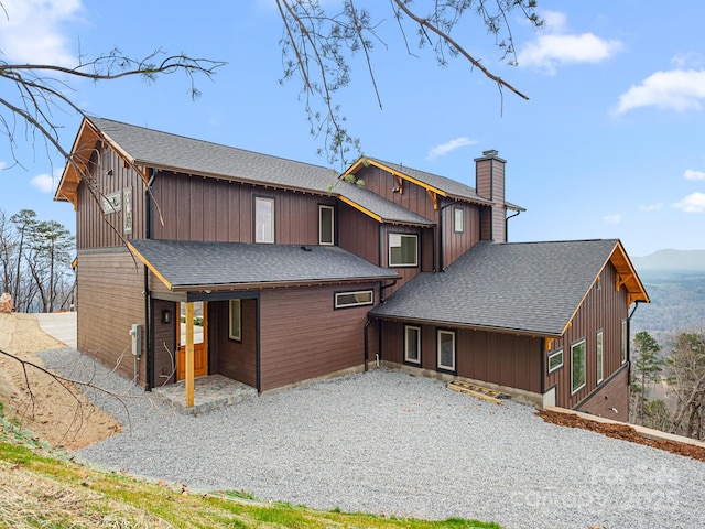 246 Half Moon Mile, Lake Lure, NC 28746 - back of property with roof with shingles and a chimney