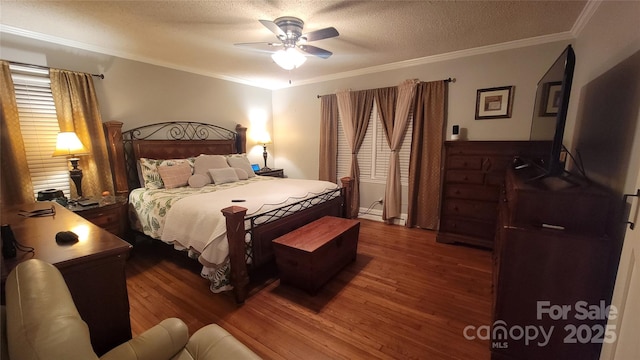 bedroom featuring wood-type flooring, ceiling fan, a textured ceiling, and crown molding