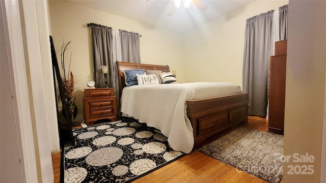 bedroom with hardwood / wood-style flooring and ceiling fan