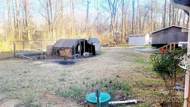 view of yard with a storage unit