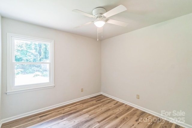 711 E John St, Matthews, NC 28105 - empty room with light wood-type flooring and ceiling fan