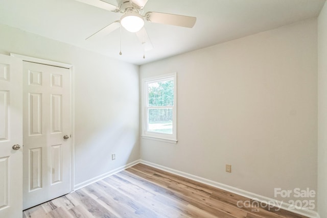 711 E John St, Matthews, NC 28105 - spare room featuring light wood-style flooring and a ceiling fan