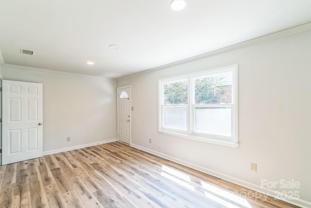 711 E John St, Matthews, NC 28105 - unfurnished room with crown molding, light wood-type flooring, and recessed lighting