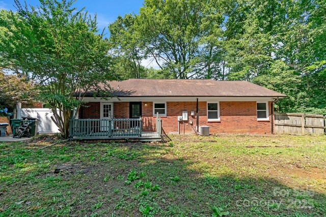 711 E John St, Matthews, NC 28105 - ranch-style house with a deck and brick siding