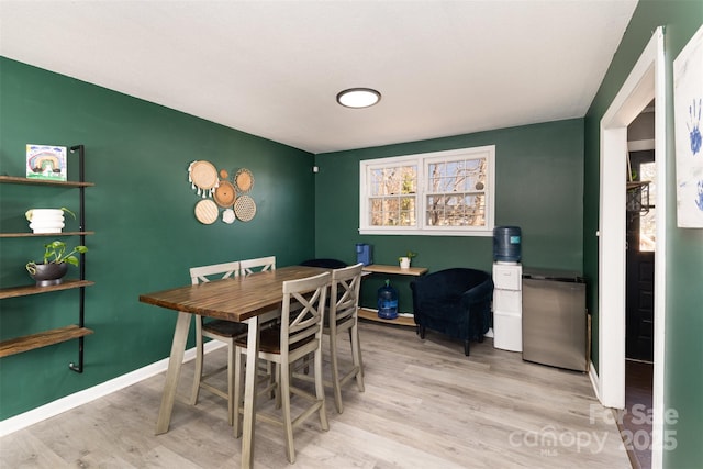 dining area featuring light wood-type flooring