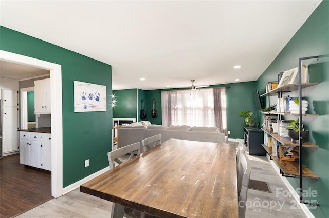 dining area featuring wood-type flooring