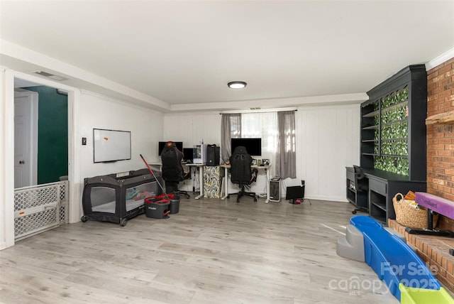 office featuring plenty of natural light and light hardwood / wood-style flooring