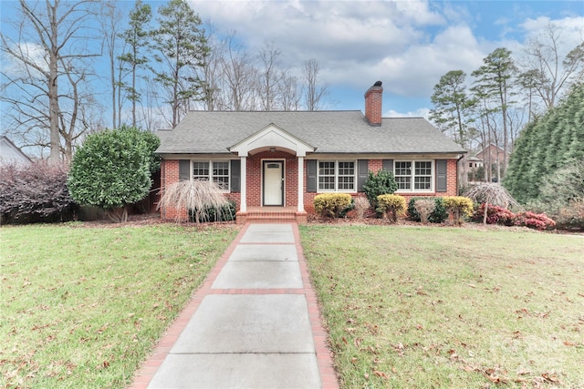 ranch-style house with a front lawn