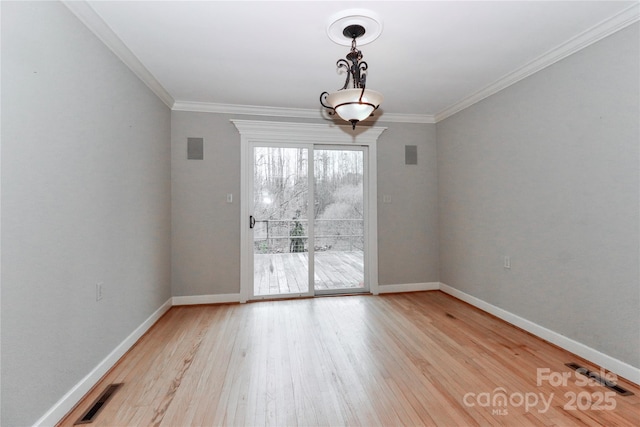 unfurnished dining area with ornamental molding and light hardwood / wood-style floors