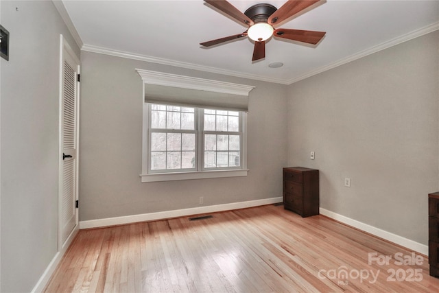 empty room featuring crown molding, ceiling fan, and light hardwood / wood-style flooring