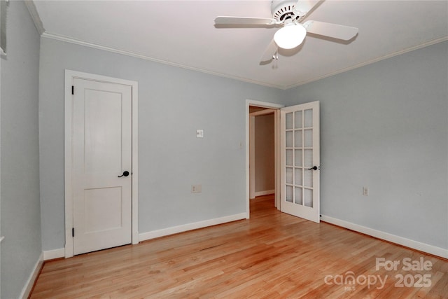 unfurnished room with ornamental molding, ceiling fan, and light hardwood / wood-style floors