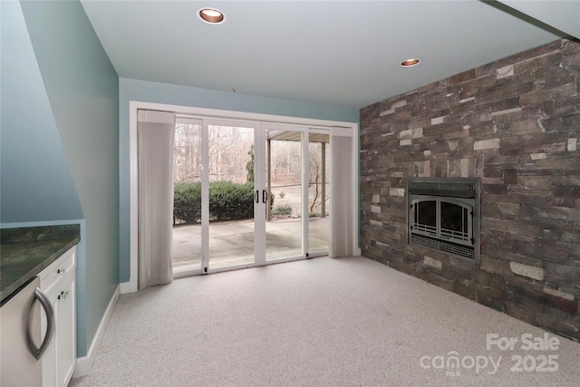 unfurnished living room with carpet and french doors