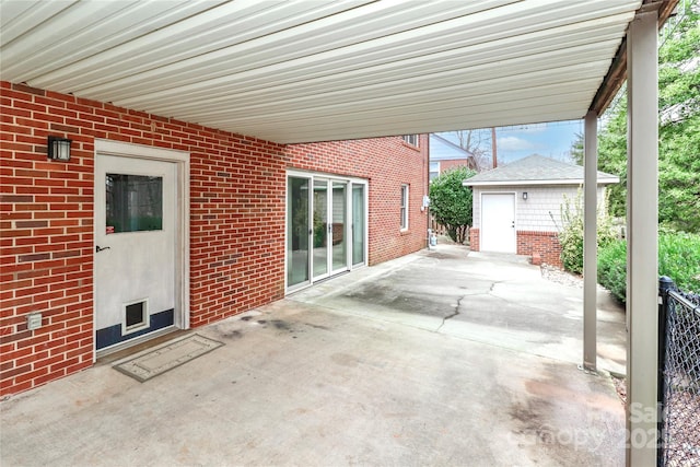 view of patio / terrace with an outbuilding