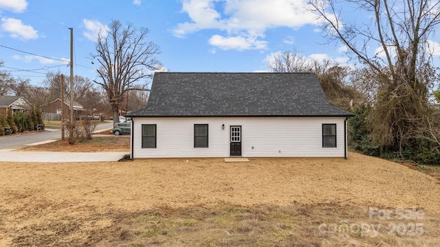 view of outbuilding with a lawn