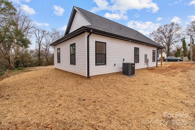 view of side of home with cooling unit