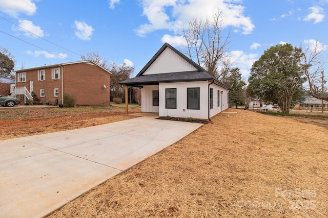 back of property featuring a carport