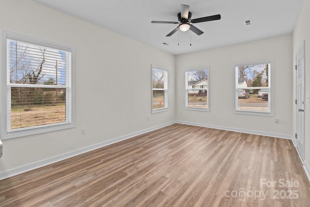 unfurnished room featuring ceiling fan and light hardwood / wood-style floors