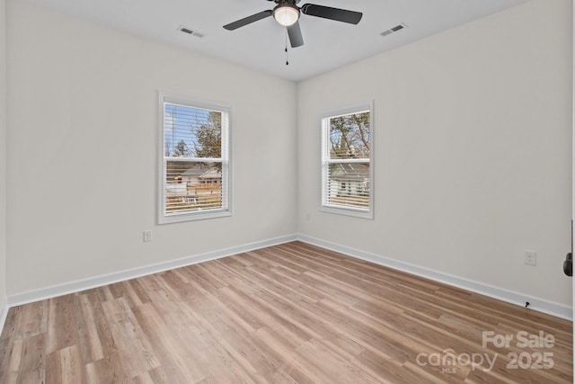 unfurnished room featuring light hardwood / wood-style flooring and ceiling fan