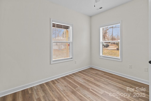 unfurnished room with light hardwood / wood-style floors and ceiling fan