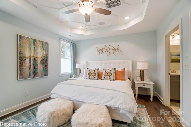 bedroom with sink, ceiling fan, ensuite bathroom, coffered ceiling, and dark hardwood / wood-style flooring