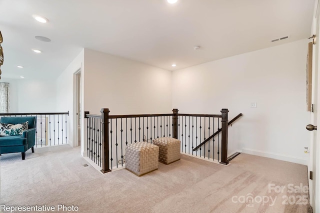 hall with light carpet