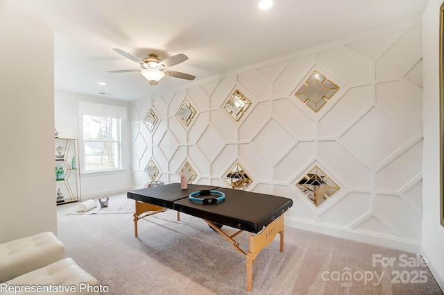 office space featuring carpet floors and ceiling fan
