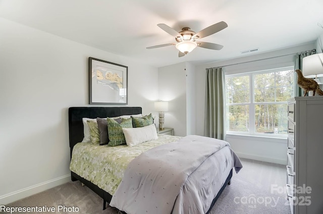 carpeted bedroom with ceiling fan