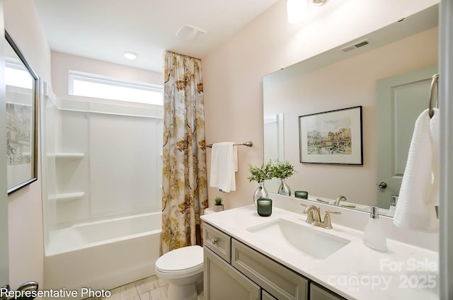 full bathroom with vanity, shower / bath combination with curtain, and toilet