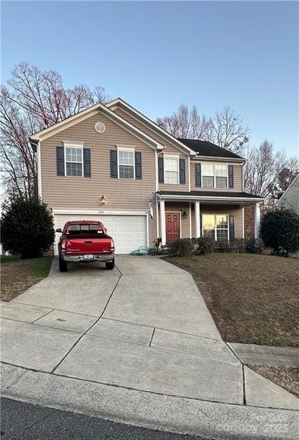 view of front of property with a porch and a garage