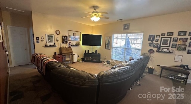 living room featuring carpet floors and ceiling fan