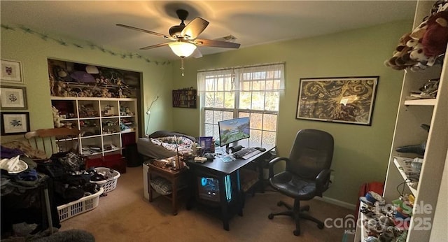 carpeted home office with ceiling fan