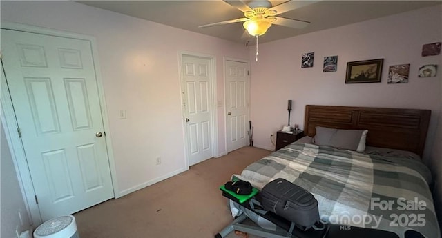 carpeted bedroom with ceiling fan