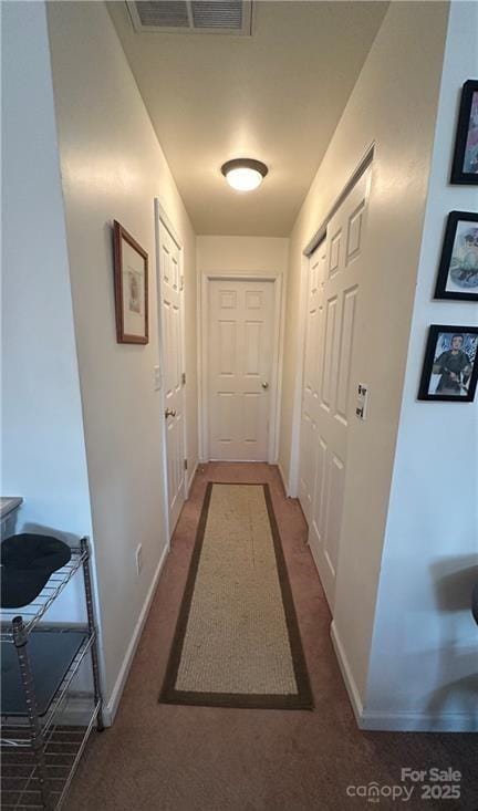 corridor with dark carpet