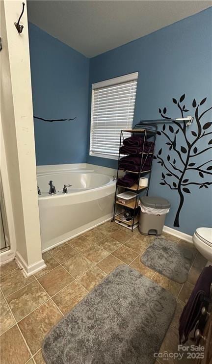 bathroom featuring tile patterned floors, toilet, and plus walk in shower