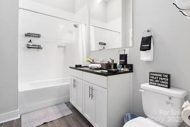 full bathroom featuring vanity, wood-type flooring, shower / bath combo, and toilet